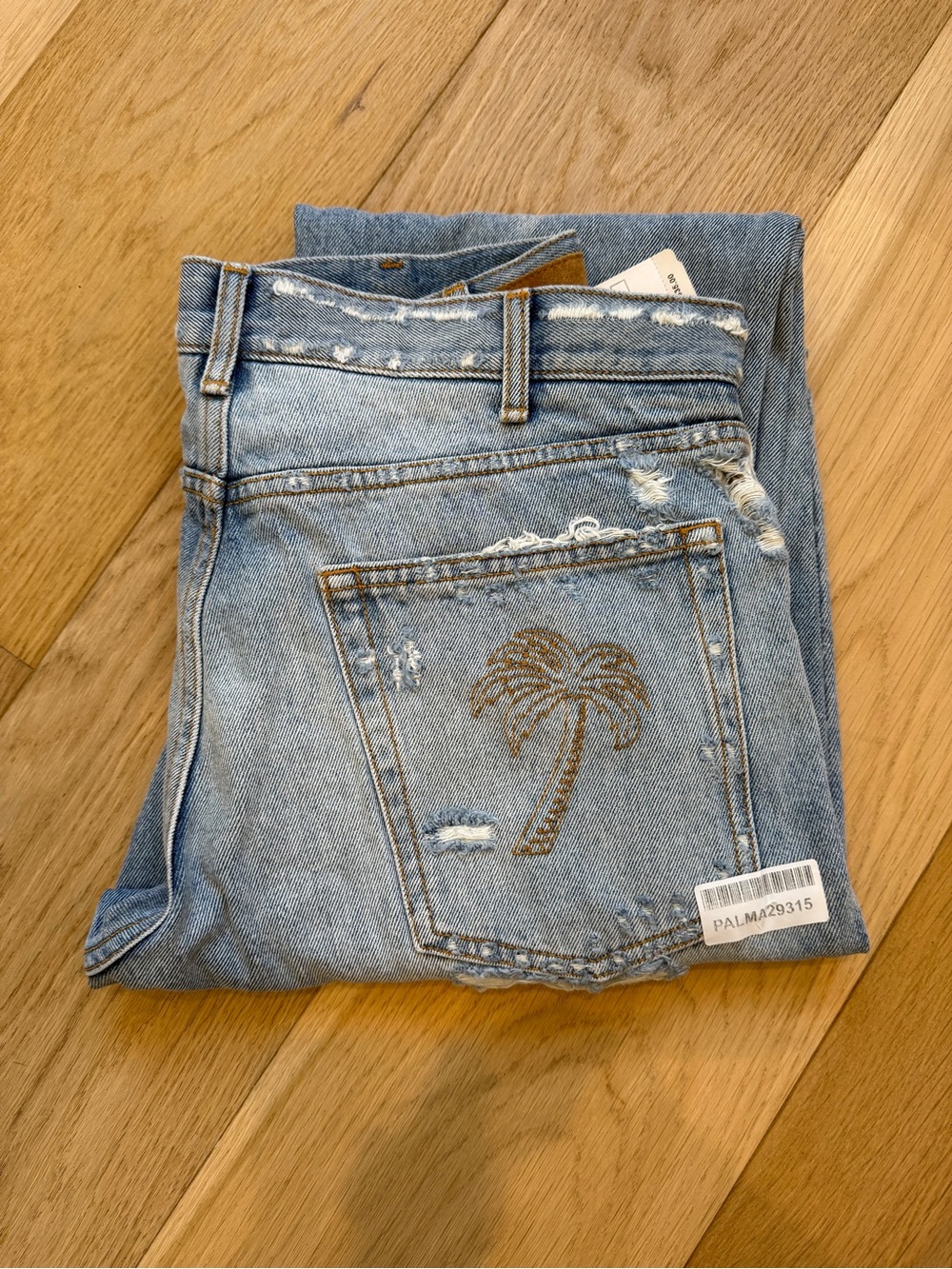 Palm Angels Light Blue Distressed Denim Jeans with Embroidered Palm